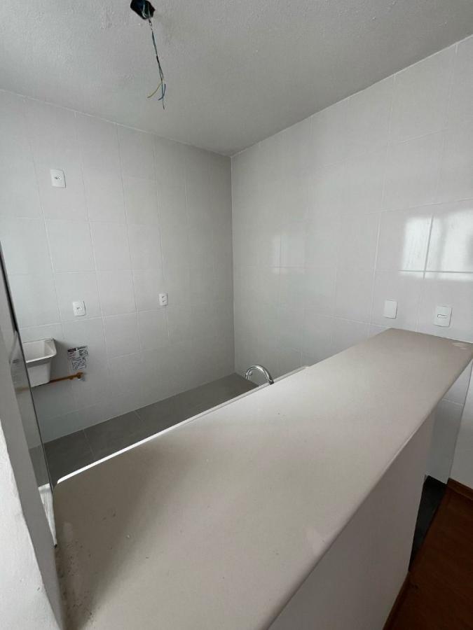 Cozinha americana com área de serviço integrada