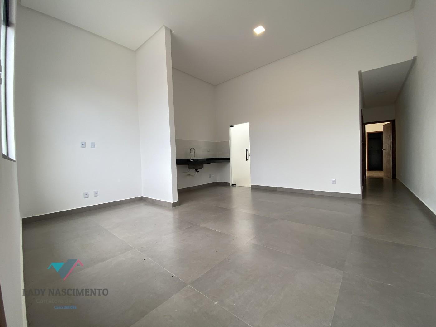 sala de estar em conceito aberto com cozinha